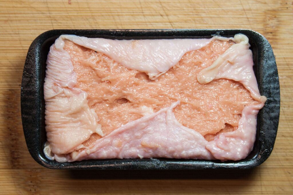 Hähnchen pate 8 https://oxbe.de/wp-content/uploads/2023/01/download.png Haehnchenpate-in-Schale-gefuellt-mit-umgeschlagener-Haut-in-Schale-fertig-zum-garen_